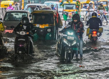 NEW DELHI INDIA FEBRUARY 1 2024 Commuters move through a water logged street after heavy rains lashes out the city at Pandav Nagar Underpass on February 1 2024 in New Delhi India Photo by Raj K Raj Hindustan Times  clipart