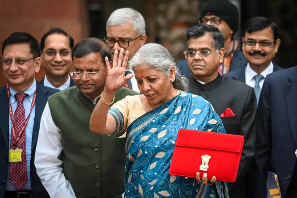 stock image NEW DELHI INDIA FEBRUARY 1 2024 Nirmala Sitharaman Union Minister of Finance along with Bhagwat Karad and Pankaj Chaudhary MOS Finance leaves the Finance Ministry carrying the Finance Budget ahead of the presentation of interim Budget 2024 in Parliam