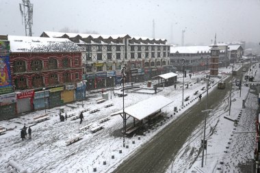 SRINAGAR INDIA FEBRUARY 4 2024 A view of the Lal Chowk Ghanta Ghar during a snowfall on February 4 2024 in Srinagar India Several parts of Kashmir including Srinagar city witnessed fresh snowfall as the MeT department has forecast moderate topheavy s clipart