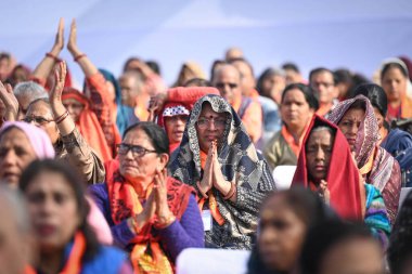 NEW DELHI INDIA FEBRUARY 5 2024 Senior citizens who are departing for Tirupati Balaji on the 89th train under Mukhyamantri Teerth Yatra Yojana interacting with Arvind Kejriwal Chief Minister of Delhi during an event at Thyagraj Stadium on February 5  clipart