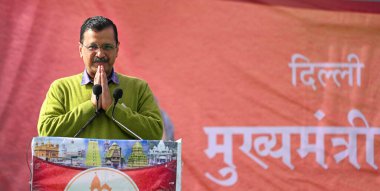 NEW DELHI INDIA FEBRUARY 5 2024 Arvind Kejriwal Chief Minister of Delhi addresses during an event for the senior citizens departing for Tirupati Balaji on the 89th train under Mukhyamantri Teerth Yatra Yojana at Thyagraj Stadium on February 5 2024 in clipart