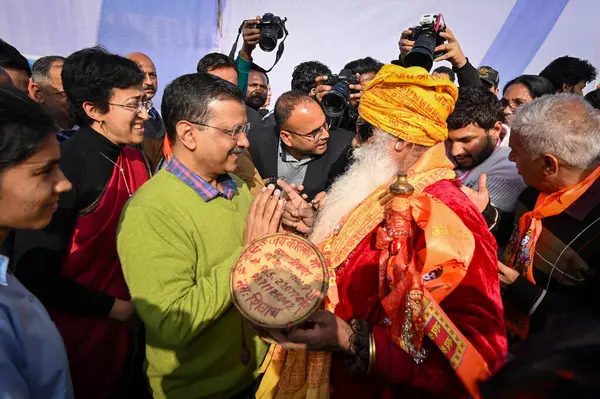 stock image NEW DELHI INDIA FEBRUARY 5 2024 Arvind Kejriwal Chief Minister of Delhi along with Atishi Minister of Education of Delhi meets the senior citizens departing for Tirupati Balaji on the 89th train under Mukhyamantri Teerth Yatra Yojana at Thyagraj Stad