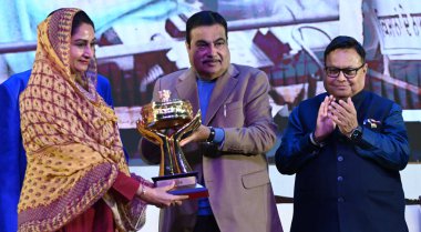 NEW DELHI INDIA FEBRUARY 6 2024 Union Minister Nitin Gadkari Lokmat Group Chairman Vijay Darda Rajendra Darda Praful Patel and Ramdas Athawale present Best Parliamentary Trophy to Shiromani Akali Dal Party MP Harsimrat Kaur Badal during the 5th Editi clipart