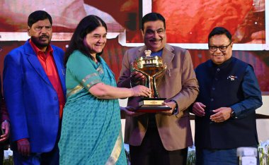 NEW DELHI INDIA FEBRUARY 6 2024 Union Minister Nitin Gadkari Lokmat Group Chairman Vijay Darda Rajendra Darda Praful Patel and Ramdas Athawale present Best Parliamentary Tropy to BJP MP Maneka Gandhi during the 5th Edition Lokmat Parliamentary Awards clipart