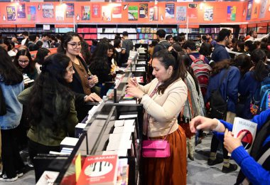 NEW DELHI INDIA FEBRUARY 10 2024 People reads or take a look at the books during World Book Fair at Pragati Maidan on February 10 2024 in New Delhi India This edition of the book fair is spread over 50000 sq meters and is set to be the biggest book f clipart