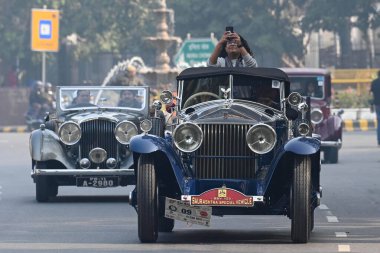 NEW DELHI INDIA FEBRUARY 11 2024 Vintage cars make their way through a road as they participate during the 57th Statesman Vintage  Classic Car Rally at Connaught Place on February 11 2024 in New Delhi India Photo by Sanchit Khanna Hindustan Times  clipart