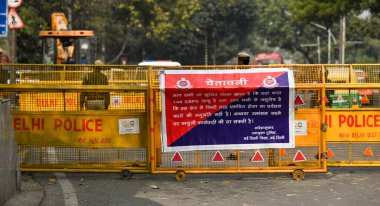 NEW DELHI INDIA FEBRUARY 14 2024 Delhi Police Barricades at the entrance point of Mathura road in view of Farmers protest on February 14 2024 in New Delhi India Massive deployments of police and paramilitary personnel besides multilayered barricading clipart