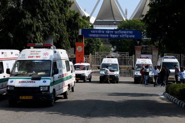 NEW DELHI INDIA FEBRUARY 17 2024 Ambulance parked during the rescue operation after a temporary structure collapsed at JLN Stadium which caused several injuries on February 17 2024 in New Delhi India The incident took place near Gate Number 2 of the  clipart