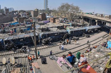 NEW DELHI INDIA FEBRUARY 17 2024 A view of 10 wagons of a goods train derailed on the Patel NagarDayabasti section on February 17 2024 in New Delhi India The incident happened when the train was passing under the Zakhira flyover on Saturday morning n clipart