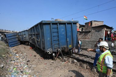 NEW DELHI INDIA FEBRUARY 17 2024 A view of 10 wagons of a goods train derailed on the Patel NagarDayabasti section on February 17 2024 in New Delhi India The incident happened when the train was passing under the Zakhira flyover on Saturday morning n clipart