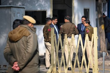 NEW DELHI INDIA FEBRUARY 19 2024 Delhi Police officials seen outside the house of Delhi CM Arvind Kejriwal after the Delhi CM was summoned sixth time to appear before the Enforcement Directorate at Civil Lines on February 19 2024 in New Delhi India D clipart