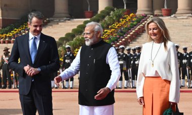 NEW DELHI INDIA FEBRUARY 21 2024 Prime Minister Narendra Modi greets Prime Minister of Greece Kyriakos Mitsotakis and his wife Mareva GrabowskiMitsotaki during the latters ceremonial reception at the Rashtrapati Bhavan on February 21 2024 in New Delh clipart