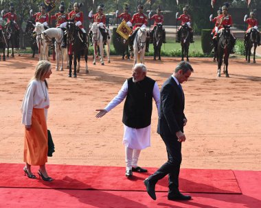 NEW DELHI INDIA FEBRUARY 21 2024 Prime Minister Narendra Modi greets Prime Minister of Greece Kyriakos Mitsotakis and his wife Mareva GrabowskiMitsotaki during the latters ceremonial reception at the Rashtrapati Bhavan on February 21 2024 in New Delh clipart