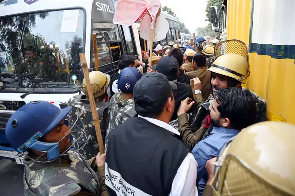 stock image GURUGRAM INDIA FEBRUARY 20 2024 Farmers attempting to travel to Delhi in support of the Punjab farmers protest were detained by Haryana Police in Manesar near the HUDA office on February 20 2024 in Gurugram India Photo by Parveen Kumar Hindustan Time