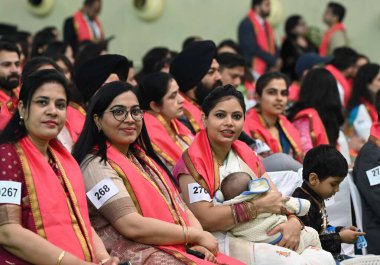 NEW DELHI INDIA FEBRUARY 24 2024 Students arrived to receive their Degrees and medals during the 100th convocation of the Delhi University to award medals and prizes to the meritorious students and confer the degrees at DU Sports complex on February  clipart