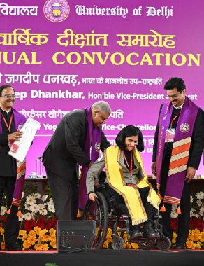 NEW DELHI INDIA FEBRUARY 24 2024 Vice President Jagdeep Dhankhar with Delhi University ViceChancellor Yogesh Singh presented Degrees and medals to students during the 100th convocation of the Delhi University to award medals and prizes to the meritor clipart