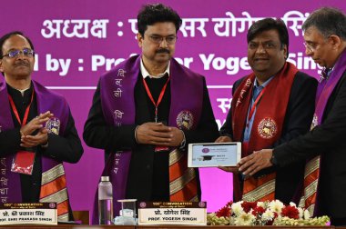 NEW DELHI INDIA FEBRUARY 24 2024 DU Vice Chancellor Prof Yogesh Singh felicitation the Digital Degree to the students during the 100th convocation of the Delhi University to award medals and prizes to the meritorious students and confer the degrees a clipart