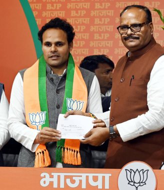 NEW DELHI INDIA FEBRUARY 25 2024 Ritesh Pandey Lok Sabha MP from Ambedkar Nagar joins BJP in presence of UP Dy CM Brajesh Pathak and other BJP leaders on February 25 2024 in New Delhi India Ritesh Pandey said he had worked for the BSP for the last 15 clipart