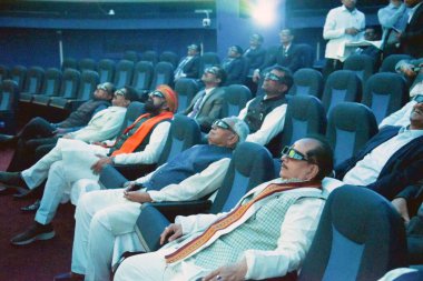 PATNA INDIA FEBRUARY 28 2024 Bihar Chief Minister Nitish Kumar enjoying 3D show at auditorium of Indira Gandhi Planetarium also known as the Patna Planetarium during its inauguration after upgradation work of Planetarium on February 28 2024 in Patna  clipart