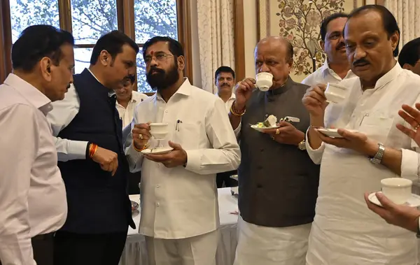 stock image MUMBAI INDIA FEBRUARY 25 2024 Dy CM Devendra Fadnavis CM Eknath Shinde shares light moment with Girish Mahajan along with Dy CM Ajit Pawar during the high tea ahead of Budget session at Sahyadri Guest House on February 25 2024 in Mumbai India Photo b