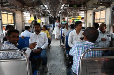 NAVI MUMBAI INDIA JANUARY 12 2024 Commuters after flaging off of trains starting from Uran to Nerul by PM Narendra Modi flags at Uran Photo by Bachchan Kumar HT PHOTO  clipart