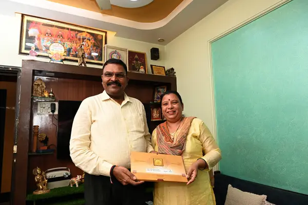 stock image NAVI MUMBAI INDIA JANUARY 19 2024 Mr Vithhal Kamble & Mrs Ujawala Kamble with invitation letter for consecration of Shri Ram Lalla idol at Ayodhya Ram Temple at Khargjhar on January 19 2024 in Navi Mumbai India 11 couples selected from all over the c