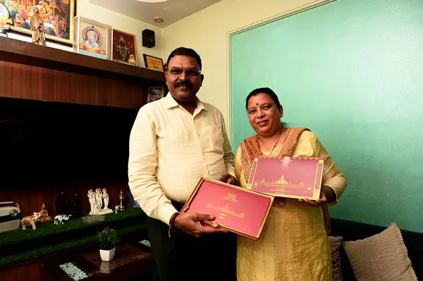 stock image NAVI MUMBAI INDIA JANUARY 19 2024 Mr Vithhal Kamble & Mrs Ujawala Kamble with invitation letter for consecration of Shri Ram Lalla idol at Ayodhya Ram Temple at Khargjhar on January 19 2024 in Navi Mumbai India 11 couples selected from all over the c