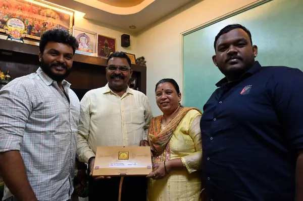 stock image NAVI MUMBAI INDIA JANUARY 19 2024 Mr Vithhal Kamble & Mrs Ujawala Kamble with sons Mihir and Aditya with invitation letter for consecration of Shri Ram Lalla idol at Ayodhya Ram Temple at Khargjhar on January 19 2024 in Navi Mumbai India 11 couples s