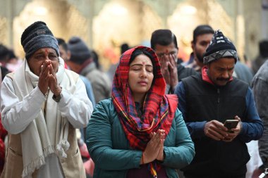 NEW DELHI INDIA JANUARY 1 2024 Devotees seen in long queues on the first day of the year at Jhandewalan Temple Photo by Sanchit Khanna Hindustan Times  clipart