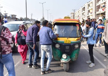 GHAZIABAD INDIA JANUARY 2 2024 Drivers are protesting against the hit and run law by stopping buses and autos on GT road near Loha Mandi on January 2 2024 in Ghaziabad India Commercial vehicle drivers on Monday staged massive protests in several stat clipart