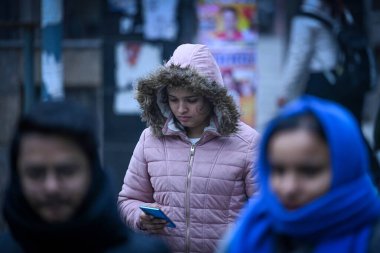 NEW DELHI INDIA JANUARY 2 2024 Commuters seen out on a Cold morning at Karol Bagh Photo by Sanchit Khanna Hindustan Times  clipart