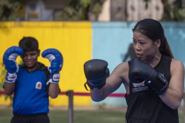 MUMBAI INDIA JANUARY 6 2024 Masterclass on boxing & self defense by Legendary Indian boxer Mary Kom with Orchid international school children at Versova The school intention behind the workshop is to create a curriculum for boxing in the school with  clipart