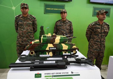 NEW DELHI INDIA JANUARY 11 2024 Army personnel stand with a model of Ganga Hybrid Anti Drone System during the military exhibition after the annual press conference ahead of Army Day at Manekshaw Centre Photo by Sonu Mehta Hindustan Times  clipart