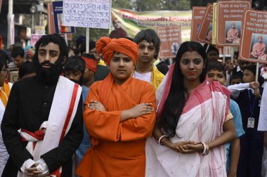 KOLKATA INDIA JANUARY 12 2024 On 161th birth anniversary of Swami Vivekananda student dressed as Vivekananda participate in a colorful procession from Swami ji ancestral house Photo by Samir Jana Hindustan Times  clipart