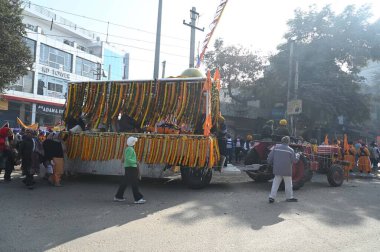 GURUGRAM INDIA JANUARY 14 2024 A glimpse of the Nagar Kirtan procession ahead of birth anniversary of the tenth Guru Gobind Singh at new colony near police chowki Photo by Parveen Kumar Hindustan Times  clipart