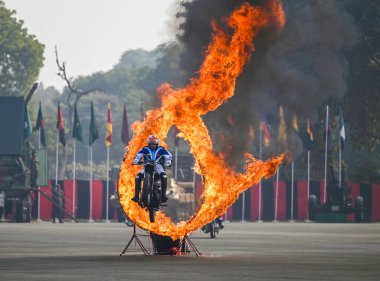 LUCKNOW INDIA JANUARY 15 2024 The Corps of Signals Dare Devils the motorcycle squad of the Indan Army mesmerises the audience with their performance during the Army Day Parade at 11 Gorkha Rifles Regimental Center GRRC Parade Ground Photo by Deepak G clipart