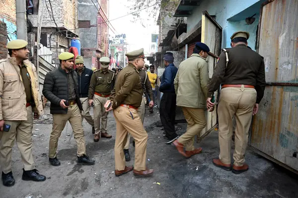 stock image NOIDA INDIA JANUARY 14 2024 Noida Police conducting search operation in slum area before the establishment day of Ram temple on 22nd January in Sector 17 Police sources said that ahead of the Ram Mandir inauguration 10000 Uttar Pradesh Police personn