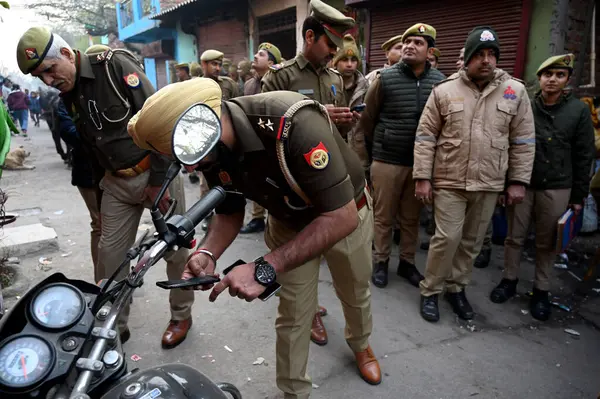 stock image NOIDA INDIA JANUARY 14 2024 Noida Police conducting search operation in slum area before the establishment day of Ram temple on 22nd January in Sector 17 Police sources said that ahead of the Ram Mandir inauguration 10000 Uttar Pradesh Police personn