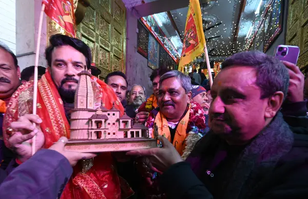 stock image NEW DELHI INDIA JANUARY 16 2024 Minister of Sports Youth Affairs and Minister of Information and Broadcasting Anurag Singh Thakur along with NDMC Vice Chairman Satish Upadhyay holds a model of the Shri Ramjanmbhoomi Mandir after cleanliness drive at 