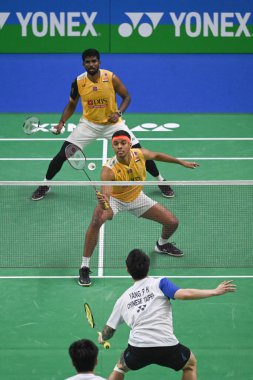 NEW DELHI INDIA JANUARY 18 2024 Satwiksairaj Rankireddy with Chirag Shetty from India competes during the Mens doubles match against Lu Ching Yao with Yang Po Han of Taiwan at the Yonex Sunrise India Open 2024 badminton tournament Photo by Sanchit Kh clipart