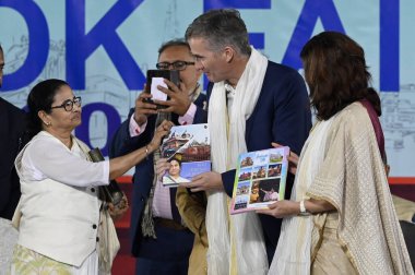 KOLKATA INDIA JANUARY 18 2024 L R Chief minister of West Bengal Mamata Banerjee British High Commissioner in India Alex Ellis and Director of British Council India Alison Barrett along with others during inauguration of 47th International Kolkata Boo clipart