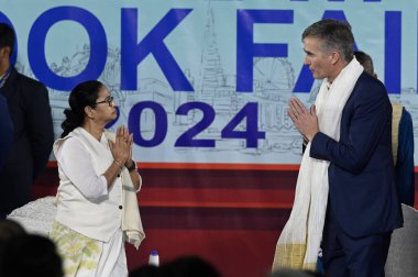 KOLKATA INDIA JANUARY 18 2024 L R Chief minister of West Bengal Mamata Banerjee and British High Commissioner in India Alex Ellis greets each other during inauguration of 47th International Kolkata Book Fair at Central Park Salk Lake on January 18 20 clipart