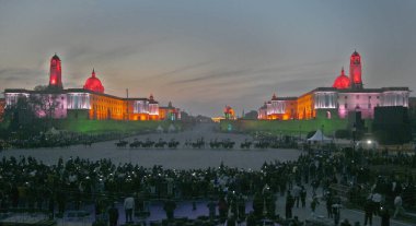 NEW DELHI INDIA JANUARY 27 2024 Visitors at the Vijay Chowk in the backdrop of illuminated Raisina Hill after full dress rehearsal for the upcoming Beating Retreat ceremony The Beating Retreat ceremony which marks the culmination of the four day long clipart