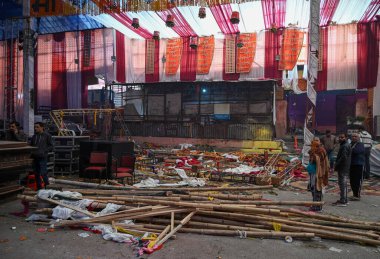 NEW DELHI INDIA JANUARY 28 2024 A view of the spot where a wooden platform collapsed during a Jagran last night reportedly at Kalkaji Temple In a tragic incident one woman was killed and 17 others were injured after a platform made of wood and iron f clipart