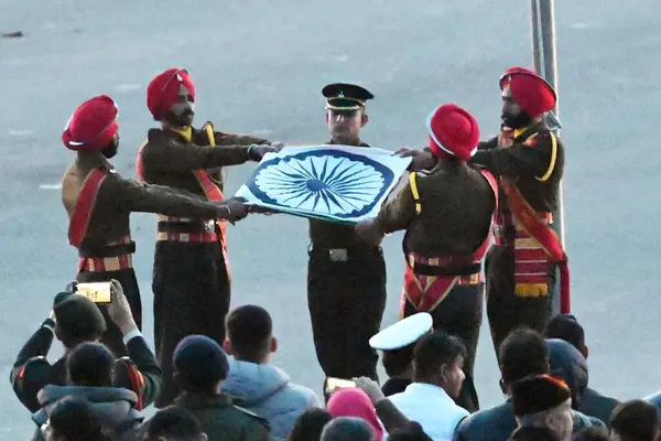 stock image NEW DELHI INDIA JANUARY 27 2024 The National Flag being unfurled during full dress rehearsal for the upcoming Beating Retreat ceremony The Beating Retreat ceremony which marks the culmination of the four day long Republic Day celebrations took place 