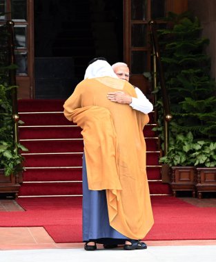 NEW DELHI, INDIA - SEPTEMBER 9: Prime Minister Narendra Modi welcomes Abu Dhabi's Crown Prince Sheikh Khaled Bin Mohammed Bin Zayed Al Nahyan upon his arrival at Hyderabad House, on September 9, 2024 in New Delhi, India.  clipart