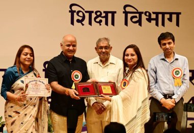 NEW DELHI INDIA SEPTEMBER 5 2024 AAP Leader and former Delhi Deputy CM Manish Sisodia facilitates meritorious teachers from MCD Schools on the occasion of Teachers Day at Kedarnath Sahni Auditorium at Civic Center on September 5 2024 in New Delhi Ind clipart