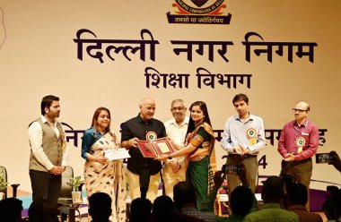 NEW DELHI INDIA SEPTEMBER 5 2024 AAP Leader and former Delhi Deputy CM Manish Sisodia facilitates meritorious teachers from MCD Schools on the occasion of Teachers Day at Kedarnath Sahni Auditorium at Civic Center on September 5 2024 in New Delhi Ind clipart