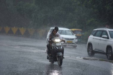 GURUGRAM INDIA SEPTEMBER 4 2024 Commuter travel on the Sohna Elevated Expressway amid heavy rains near Air Force Station on September 4 2024 in Gurugram India Delhi NCR residents witnessed a sudden change in weather as heavy rain lashed several parts clipart