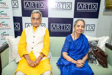 NEW DELHI INDIA AUGUST 30 2024 Prayag Shukla and Artist Shobha Broota during an art fair Artix 30 a hotel based art fair where the rooms of a premier Delhi hotel were transformed into intimate preview spaces at The Claridges Hotel on August 30 2024 i clipart